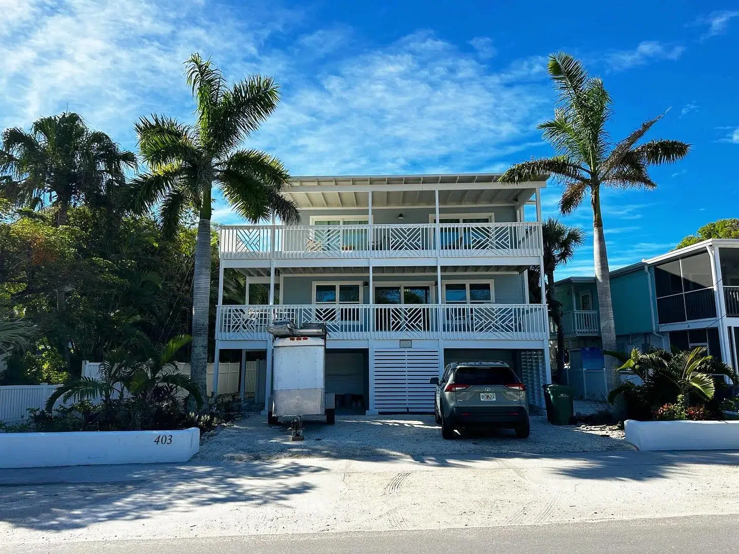 A three-story white beach house